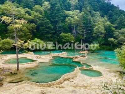 the Flamboyant Pools in Huanglong Valley